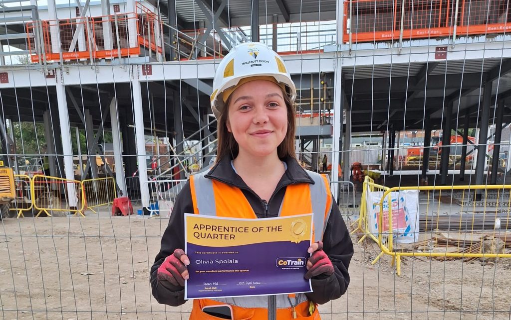 CoTrain apprentice Olivia Spoiala on site with her Apprentice of the Quarter certificate